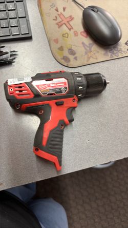Milwaukee drill driver with battery and charger