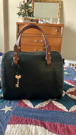 FOSSIL Leather handbag. In black with brown handles