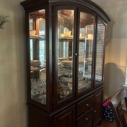 dining room table and china cabinet ; basketball court 