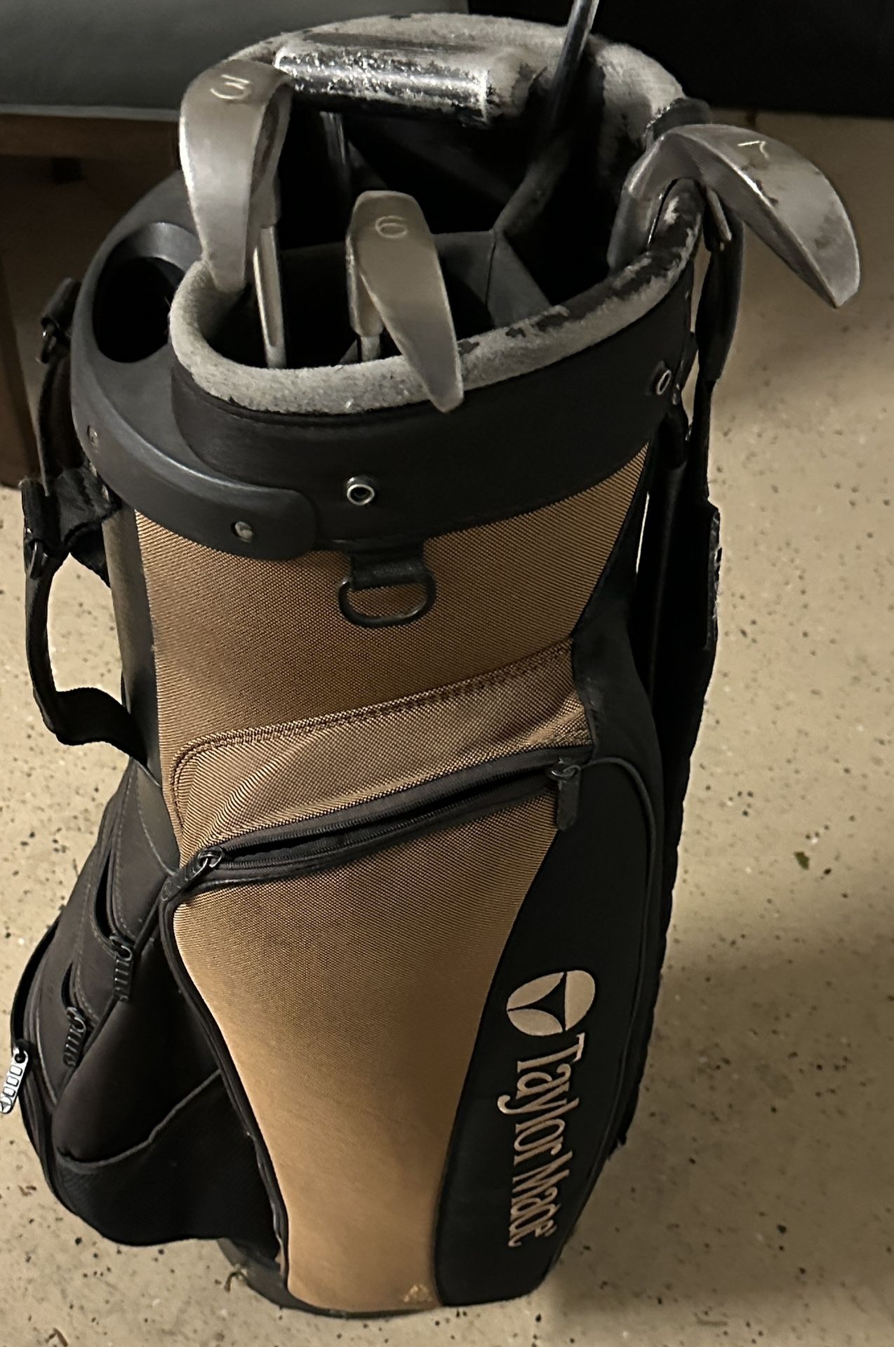 Taylor Made Golf Bag With Some Clubs