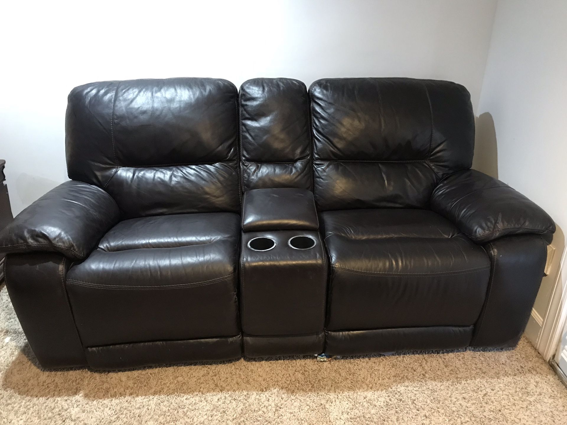Double reclining and rocking sofa in excellent condition!