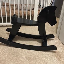 Black wooden rocking horse