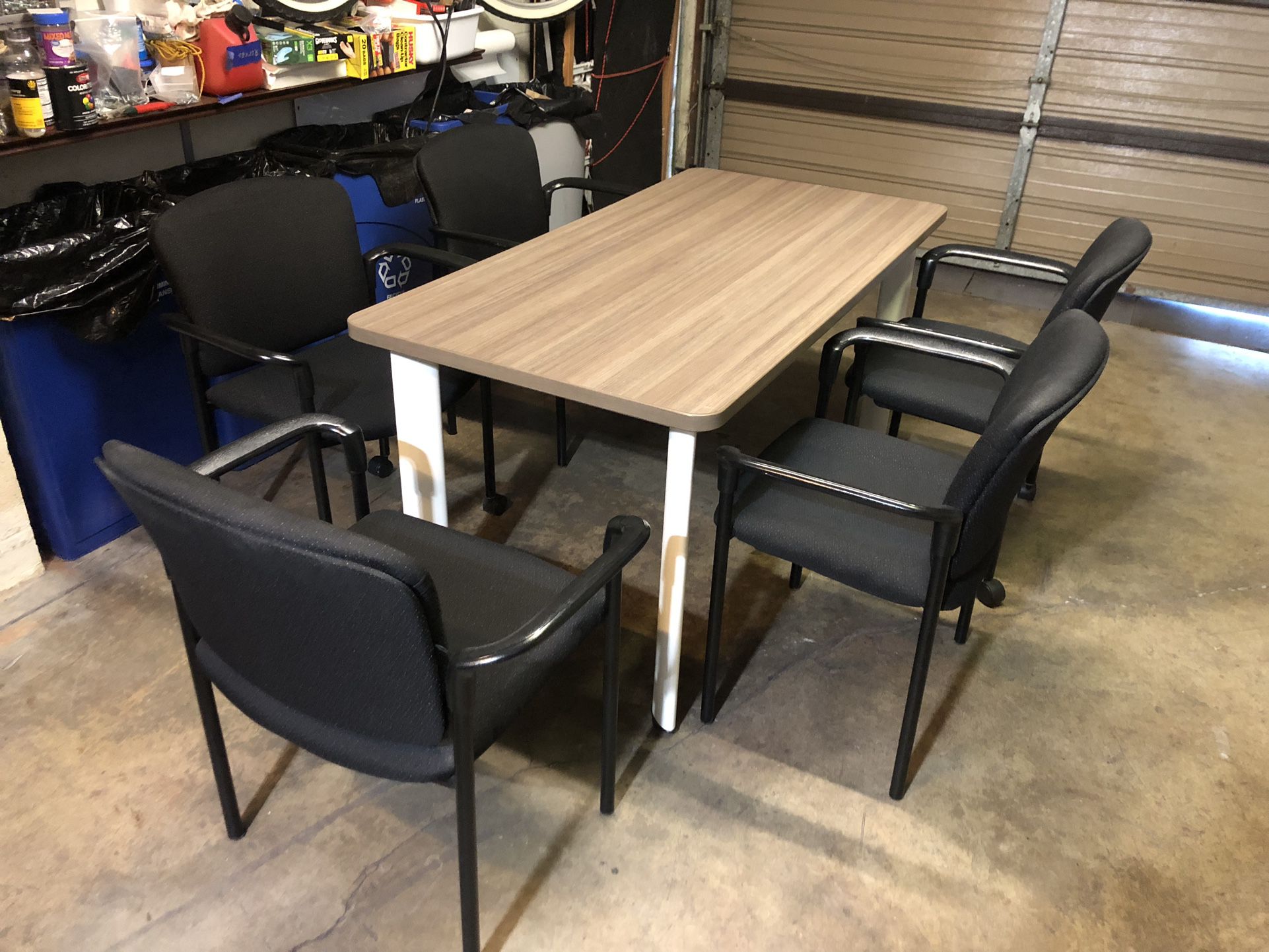 Table With 5 Black Stack Chairs 