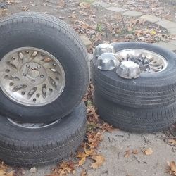 4 235/75 15 Tires, Ford rims and center caps