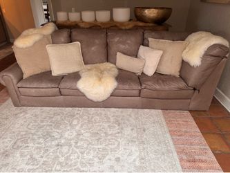 Two oversize brown leather couches