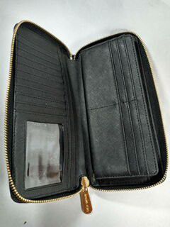 Brand new never used Michael kors accordion black leather wallet