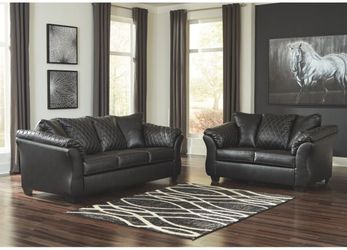 Rich black couch and love seat set!