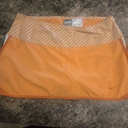 Orange Nike tennis skirt with built in shorts M(8-10) 