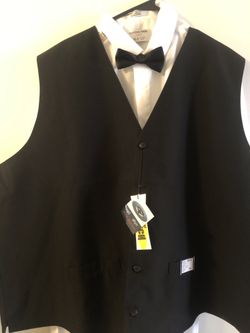 Neil Allyn Black Polyester Catering and Servers Vest. Brand New with Tags. Mens Sizes Med, Large, XL,3XL, and 5XL. Includes Black Bow Tie.