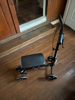 Black 4 wheel scooter: brakes work great