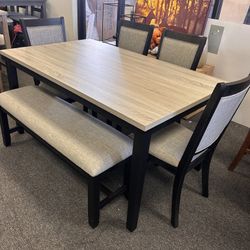 Dining Table With 4 Chairs And a Bench In Black And Gray 
