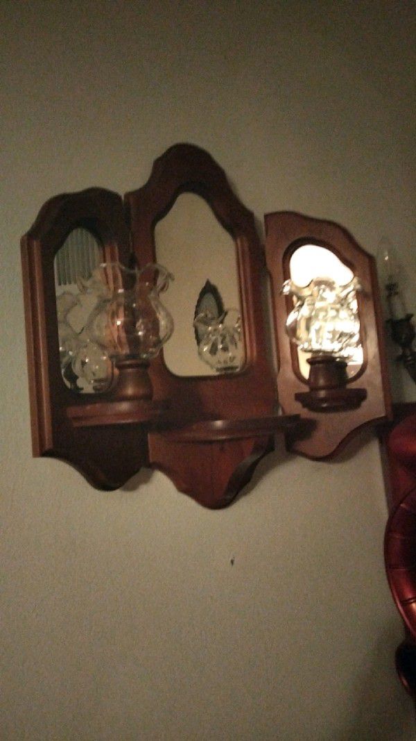Vintage Handmade 3 Section Candle Sconce with Mirror Accents.

Normal wear MAY be seen. Scratches,nick's and dents MAY be seen. Cleaning MAY be needed