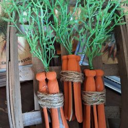 Country look Old Clothes Pins Carrots with a small Tobacco Basket.