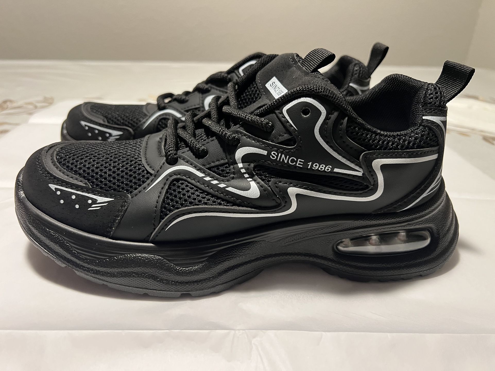 Black sneaker running shoe