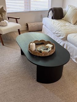 Black Oval Coffee Table with Pedestal Base