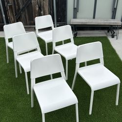 6 Ikea Stackable White Chairs