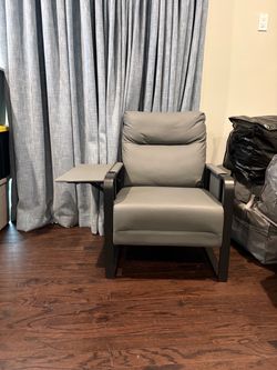 Chair with pop up shelf