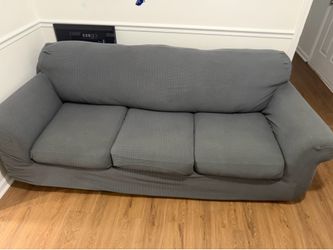 Three Cushion Sleeper Sofa with Gray sleepcover.