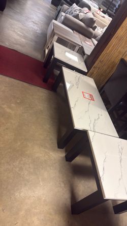 Brand new cocktail table and two end tables for $249 for the three-piece set