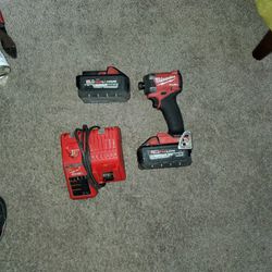 Milwaukee  Impact  2 batteries  And Charger 