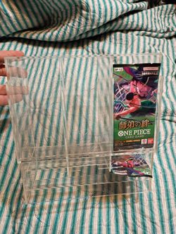 Trading card pack dispenser three slots