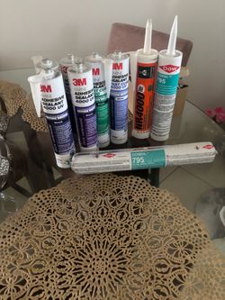 The photo appears to show 8 unopened tubes:  * Five 3M Marine 4000 UV sealants: about $35–$43 each * Two DOWSIL 795 sealants,One Sherwin-Williams NR40