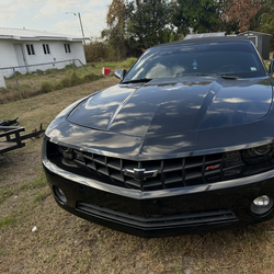 Chevy Camaro/ black two door w/ cloth top
