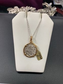 Beautiful Atocha silver coin pendant in gold bezel with silver chain