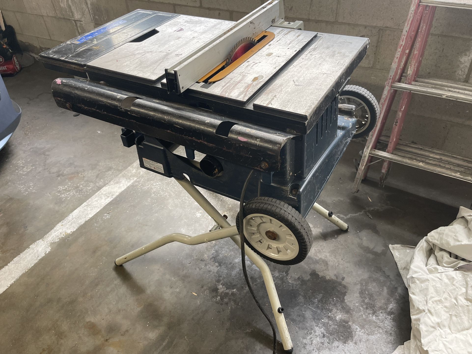 Table saw and folding ladder