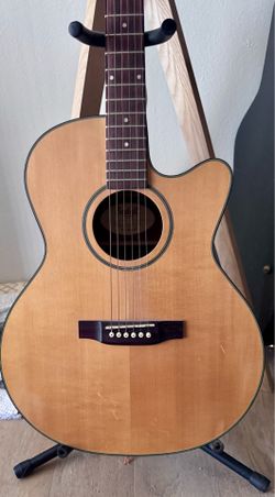 Solid top handmade electro acoustic guitar