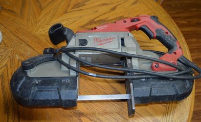 Milwaukee model #6232-20 Deep Cut Variable Speed Band Saw with one blade, works!