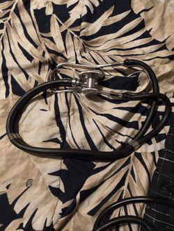 Blood pressure cuff with stethoscope