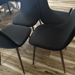 4 Black Chairs With Covers But Denim Blue Fabric