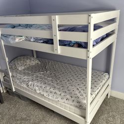 IKEA twin size bunkbed 2 4 inch mattresses included if wanted.  Total height is 5 ft.  