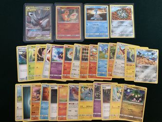 Lot of 30 Pokemon cards inlcuding 2 holo/foil