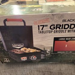 Blackstone 17" Tabletop Griddle with Hood designed for portable outdoor cooking. This item is a Blackstone 17" Tabletop Griddle with Hood designed for