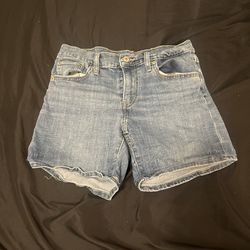 levi's jean shorts size 28 and are mid thigh