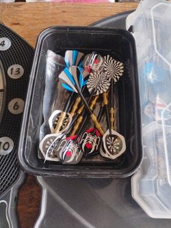 Darts and dart board game lots of darts