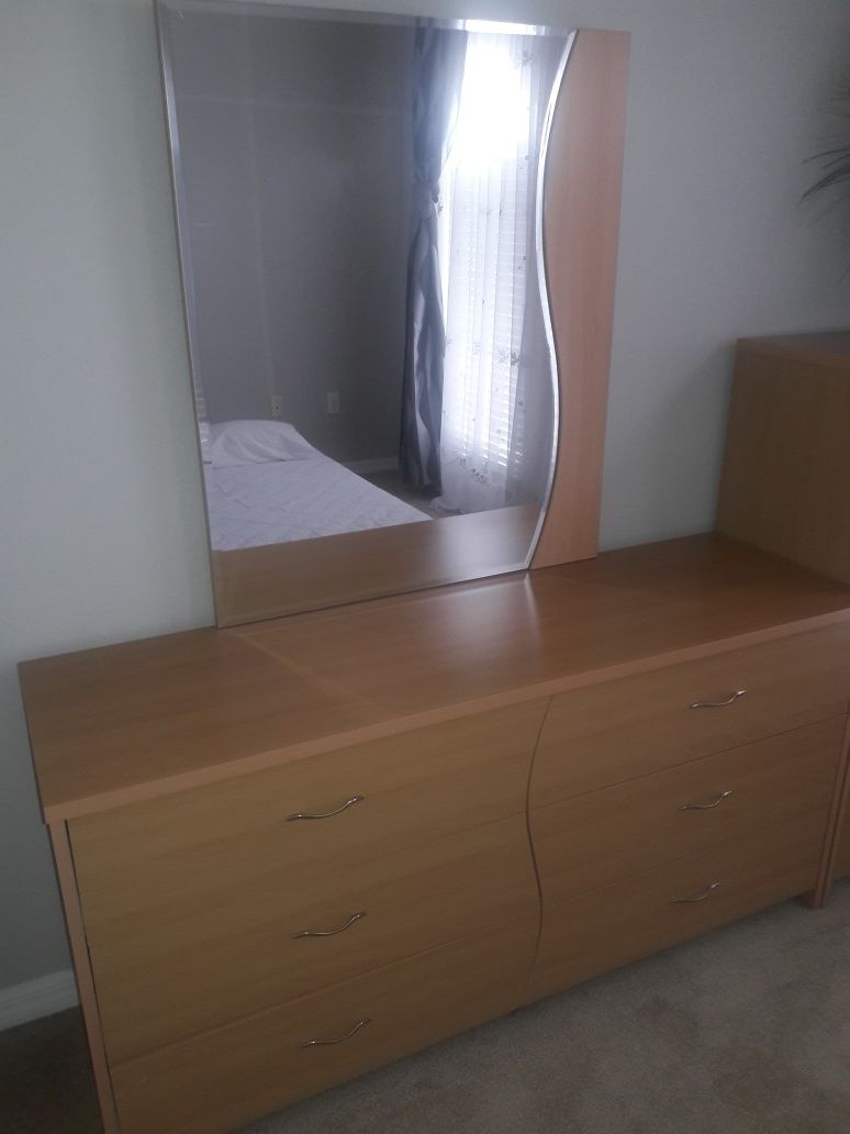 Dresser with mirror and chest.