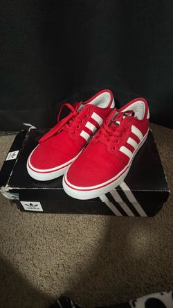 Red and white addidas