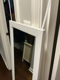 A beautiful , white, door mirror