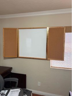 $20. Conference white board, with cork board. Fully closed and mountable.