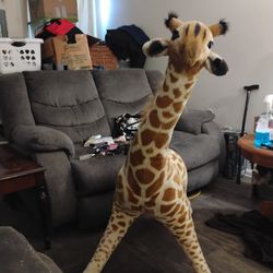 Oversized Jeffery the giraffe stuffed animal