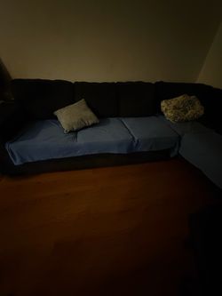 Ashley’s Furniture 2 Section Couch with Queen size pullout bed