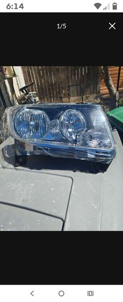 2007 Toyota Land Cruiser headlights  100 firm no less