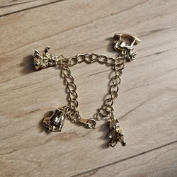 Girls Charm Bracelet Gold Tone Christmas Wishes Doll Bear Horse Ice Skates Rocking Horse VTG Avon 1993 / New - Open Box