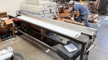Pneumatic roller shade production table