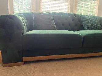 Green velvet chesterfield sofa with gold trim