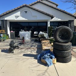 Yard sale! Bunch of tools, equipment, clothes, cards