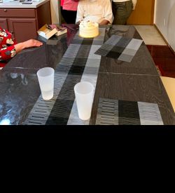 8 chair dining table good condition with table runner and centerpiece